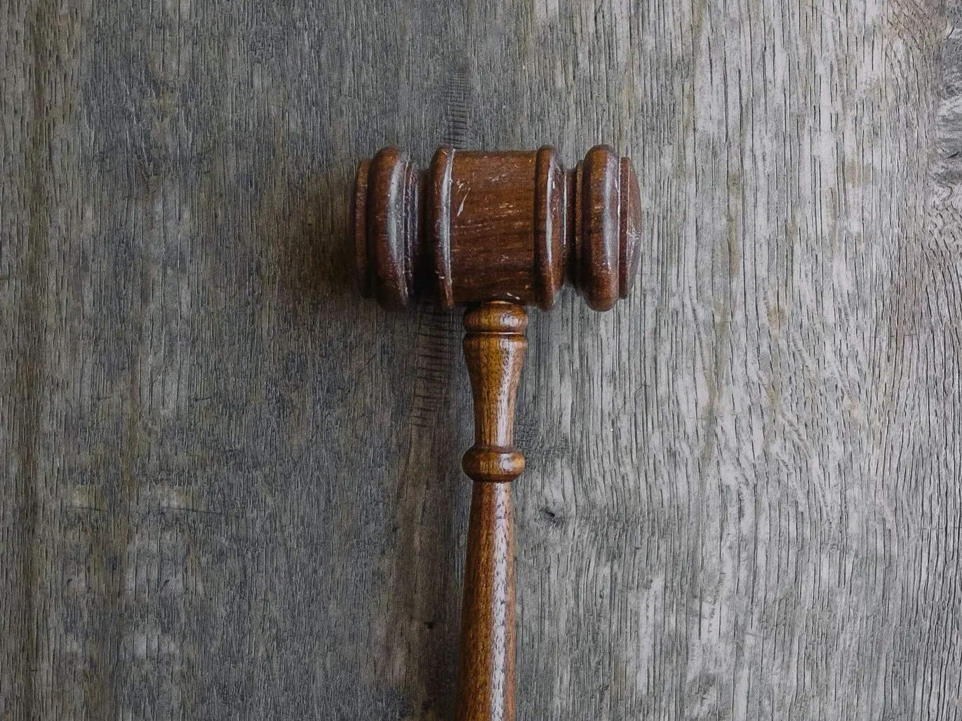 brown mallet on gray wooden surface